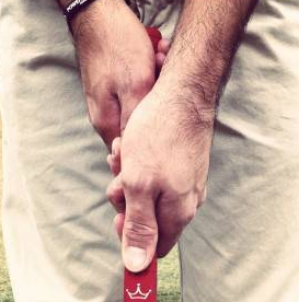 cross handed putting grip