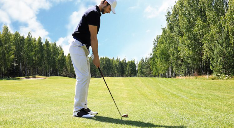 Steps for hitting low golf shots that drive through the wind